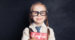 Cute,Child,Schoolgirl,Holding,Red,Book,On,Chalkboard,Background.,Speak